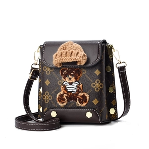 Dark brown women's crossbody bag with 3D teddy bear and classic floral pattern print