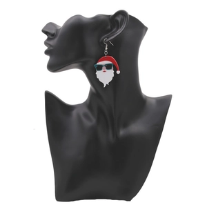 Christmas Santa Claus earrings with cool sunglasses on a black display stand