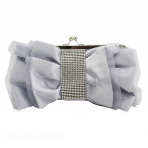 Silver satin evening clutch bag with large bow and sparkling rhinestone detail