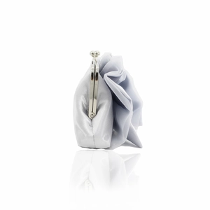 Side view of silver grey satin evening bag with decorative silk flower and metal clasp