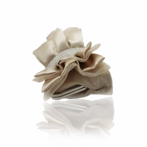 Close-up of pleated beige satin evening clutch featuring a sparkling rhinestone band detail