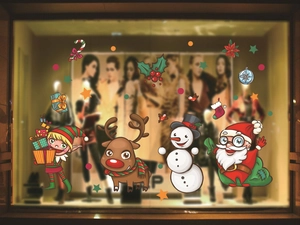Detailed Christmas window decals showing cartoon Santa and snowman on glass panels