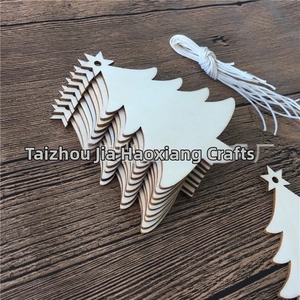 Detailed macro view of natural boxwood Christmas tree tags with white hanging strings