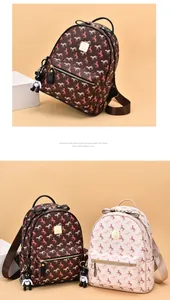 Close-up of mini faux leather backpacks with vintage horse prints and bow tie details