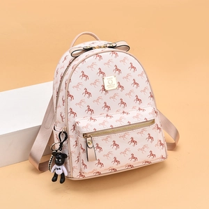 Beige leather backpack with horse print and bow detail, featuring a small bear charm
