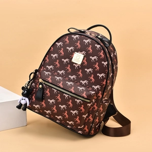 Brown faux leather backpack with pony print and a cute bear keychain ornament