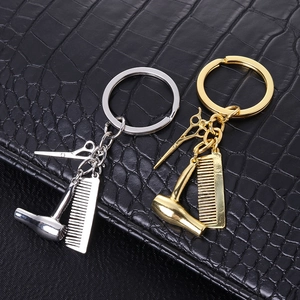 Set portachiavi da parrucchiere con forbici pettine e asciugacapelli oro e argento