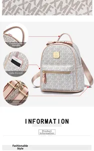 Detail of cream backpack side pocket and pink handle with soft leather texture