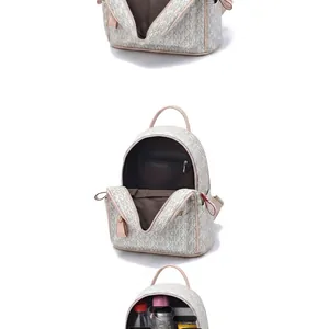 Detail view of large capacity white leather backpack interior with organized compartments