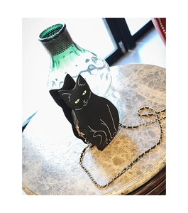 Close-up of a 3D black cat shaped crossbody bag with metallic chain and PU leather