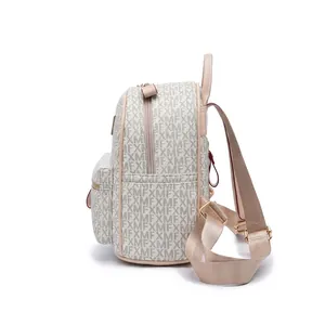 Detailed views showing the ivory backpack with XMF print and premium gold zippers