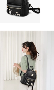 Détail d'un sac à dos en cuir grainé avec broderie délicate et finitions dorées