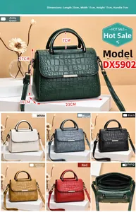 Detailed view of crocodile pattern crossbody bag showing colors and interior compartments