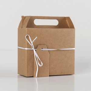 Minimalist kraft paper gift box with white ribbon and blank tag for favors