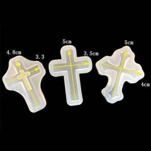 Detailed view of translucent cross shaped silicone molds with precise dimensions