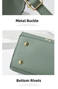 Detail of golden metal swivel hooks and anti-wear bottom rivets on grass green bag