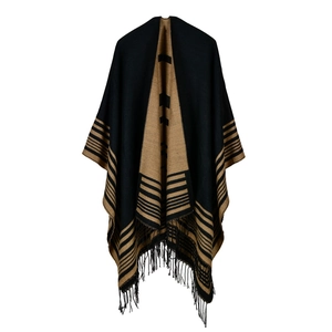 Detail of knit shawl featuring thick fabric texture and long fringe tassel hem decoration