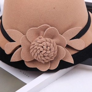 Detailed close-up of khaki wool felt fedora featuring a handcrafted 3D flower embellishment