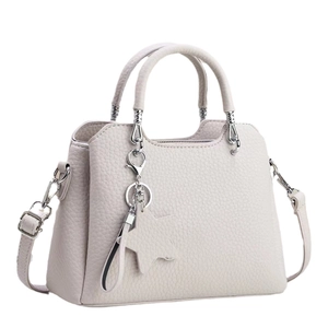 White lychee pattern leather shoulder bag with silver hardware and star charm accessory