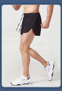 Close-up of breathable mesh running shorts featuring side slits and an adjustable drawstring