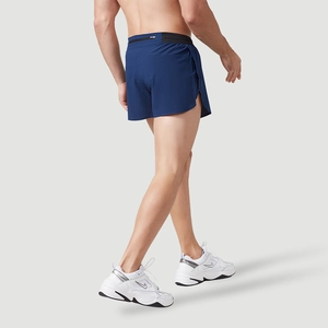 Men's navy running shorts with elastic waistband and back zipper pocket in action view