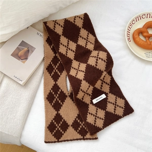 Close-up of 100% wool tag on argyle knit scarf in brown and khaki tones