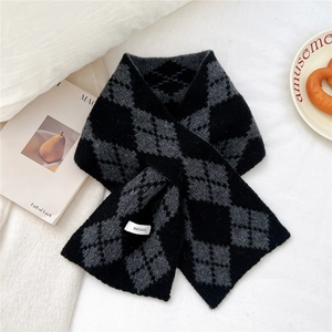 Detail showing the 100% wool material and argyle knit pattern of the warm winter scarf