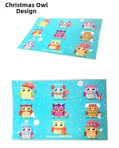Detail view of cartoon owl Christmas mat with Merry Christmas text and blue background