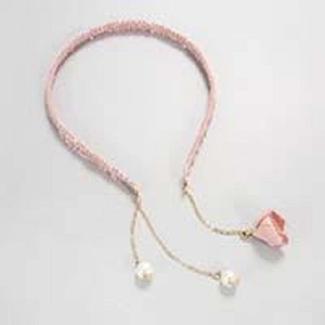 Pink woven headband featuring golden tassel chains with white pearls and pink flowers