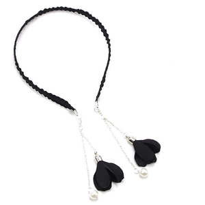 Detail of black twisted fabric headband with silver fringe chains and pearl flower charms