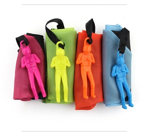 Flat lay of colorful hand-throwing parachute toys with toy soldier figurines