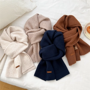 Soft knit winter scarves in beige and navy with premium leather label detail
