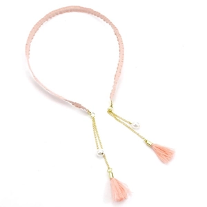 Pink braided headband with gold chains, elegant pearls, and delicate fringe tassels