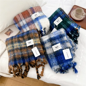 Thick striped knit scarves with tassels in various colors for winter warmth and style