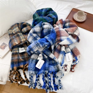 Thick striped knit scarves with tassels in various colors for winter warmth and comfort