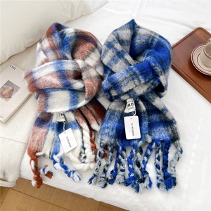 Thick striped knit tassel scarf in blue and red plaid patterns for winter warmth