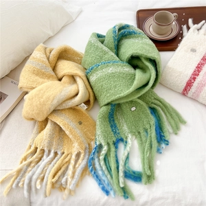 Chunky wool blend striped scarf with long tassels in ginger and green for winter warmth