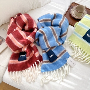 Thick wool blend striped scarves with white tassels in red, blue, and green colors