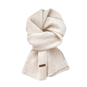 Creamy white knitted scarf with leather label and ribbed hem for winter warmth