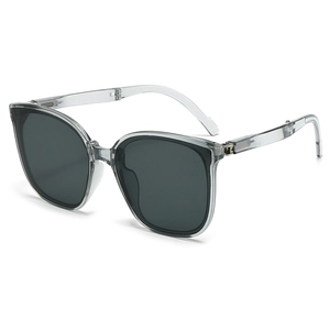 Foldable oversized sunglasses with transparent grey frames and dark lenses for women