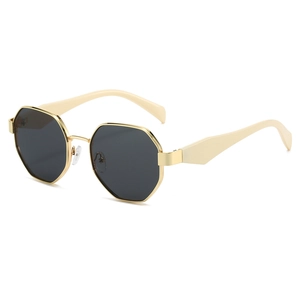 Octagonal gold metal sunglasses with dark gray lenses and wide cream white temples