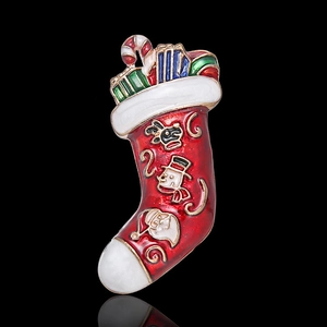 Detailed view of an enamel Christmas stocking brooch featuring Santa, snowman and deer