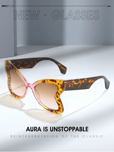 Detail of leopard print butterfly sunglasses with brown gradient lenses and wide temples