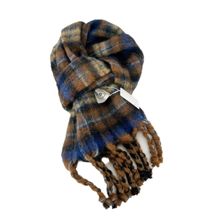 Thick striped knit scarf with long tassels in navy, brown, and yellow plaid patterns
