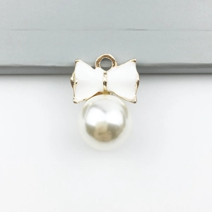 White enamel bow pendant with gold trim and white imitation pearl drop for DIY jewelry