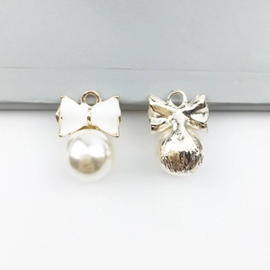 DIY jewelry alloy bow pendants with large pearls shown from front and back view