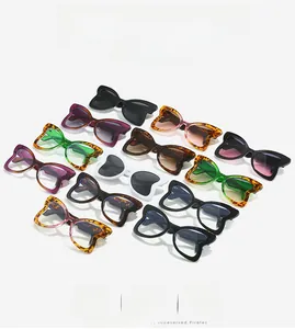 Detail view of stylish leopard butterfly frame sunglasses with curved comfort temples