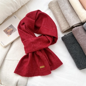 Classic red knitted wool scarf with leather patch and assorted color variants