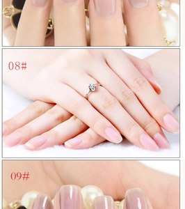 Detail of glossy jelly nail polish shades 08 and 09 with elegant silver gemstone ring