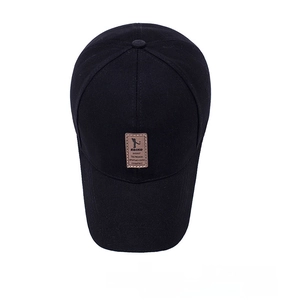 Top view of a black cotton baseball cap showing six-panel crown and brown leather patch